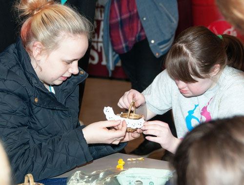 Students working together to make an Easter basket