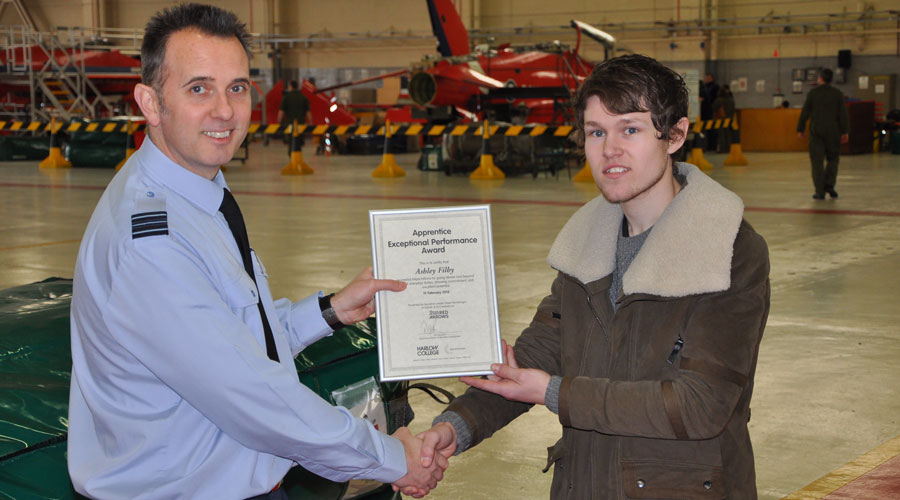 Ashley Filby receiving his Award for Exceptional Performance from Squadron Leader Pete Searle